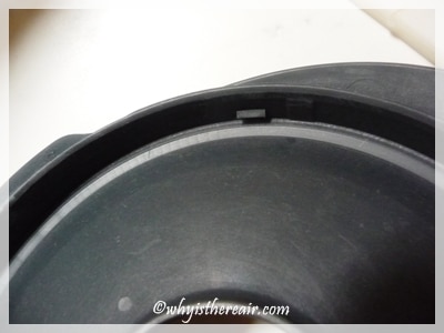 Click the sealing ring into the three clips around the inside of the lid