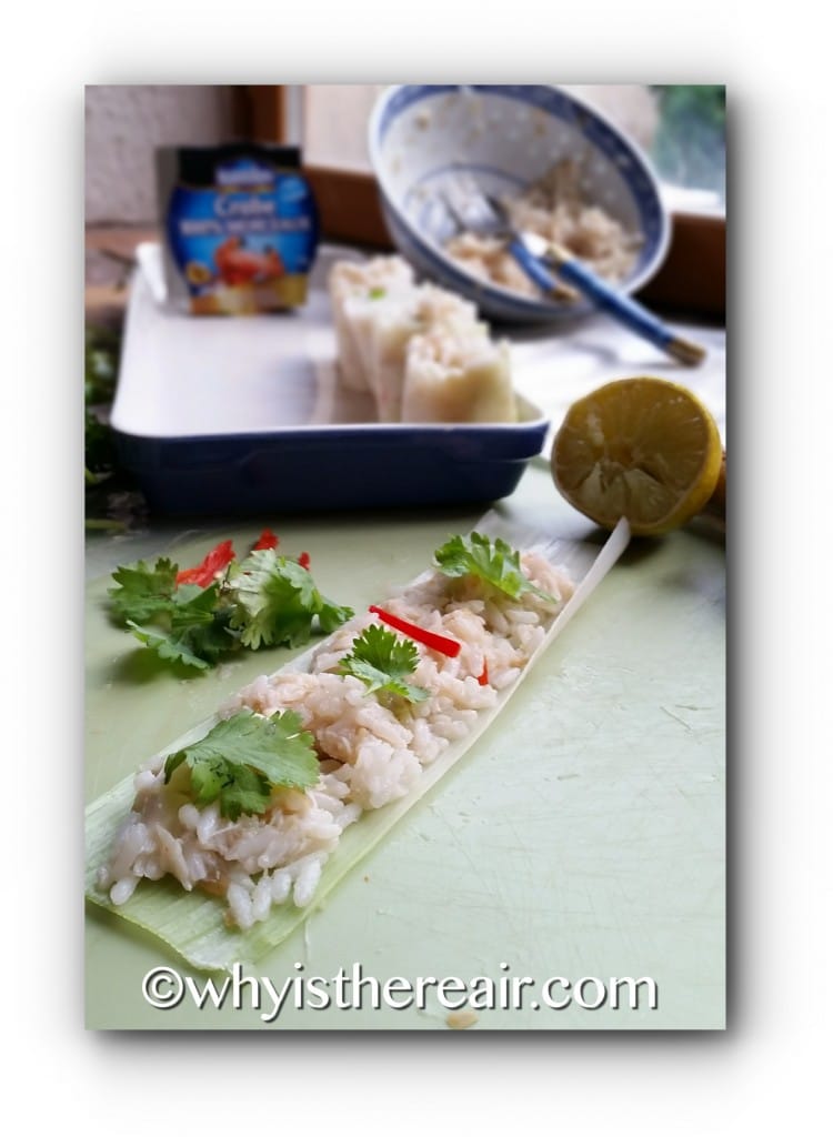 Spread leek sheets with crab and rice mixture, dot with coriander and chilli, then roll from one end