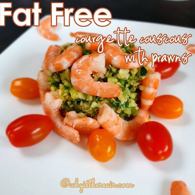 fat free prawns and courgette tabouleh on a plate with cherry tomatoes