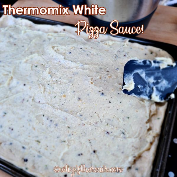 Thermomix white pizza sauce spread on unbaked crust
